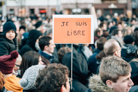 STRASBOURG, FRANCE - 11 JAN, 2015:  People hold placards reading 'I am free' during a unity rally (Marche Republicaine) where some 50000 people took part in tribute three-day killing spree in Parisのeditorial素材