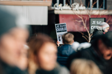 STRASBOURG, FRANCE - 11 JAN, 2015:  People hold placards reading 'Je suis Charlie' during a unity rally (Marche Republicaine) where some 50000 people took part in tribute three-day killing spree in Parisのeditorial素材