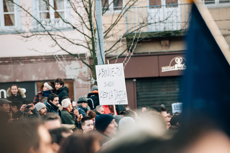 STRASBOURG, FRANCE - 11 JAN, 2015:  People hold placards reading 'Subscribe or daesh is coming' during a unity rally (Marche Republicaine) where some 50000 people took part in tribute three-day killing spree in Parisのeditorial素材