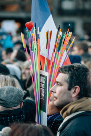 STRASBOURG, FRANCE - 11 JAN, 2015:  Man holding pencils bouquet during a unity rally (Marche Republicaine) where some 50000 people took part in tribute three-day killing spree in Parisのeditorial素材