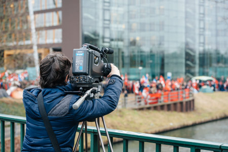 STRASBOURG, FRANCE - 28 JAN 2015 Cameraman filming Turkey diaspora near European Court of HR before...