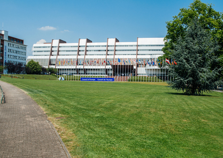 STRASBOURG, FRANCE - JUNE 29, 2010: Council of Europe main building with large signage and all European countries flags in a rowのeditorial素材