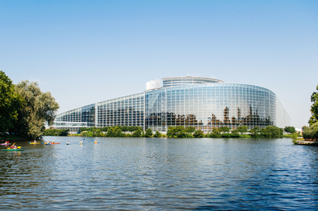 STRASBOURG, FRANCE - JUNE 29: South facade of the European Parliament in Strasbourg, France on June 29,  2010 with the intersection of the Ill and Marne-Rhine Canal and canoers. The European Parliament (or EU Parliament or the EP) is the directly elected のeditorial素材