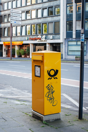 BREMEN, GERMANY - 03 JUNE: Yellow German Post (Deutsche Post DH) box on street in Bremen, Germany on June 03, 2010. Deutsche Post DHL, is the world's largest courier companyのeditorial素材