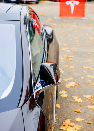 PARIS, FRANCE - NOVEMBER 29: Detail of Tesla Model S Sport Car with tesla sign in the backgroundのeditorial素材