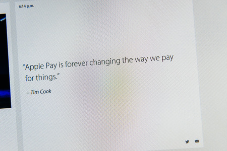 PARIS, FRANCE - MAR 9, 2015: Apple Computers event keynote tweets close up seen on iMac with Tim Cook saying about Apple Pay succes as seen on 9 March, 2015のeditorial素材