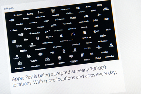 PARIS, FRANCE - MAR 9, 2015: Apple Computers event keynote tweets close up seen on iMac with number of locations accpeting Apple Pay - more than 700000 as seen on 9 March, 2015のeditorial素材