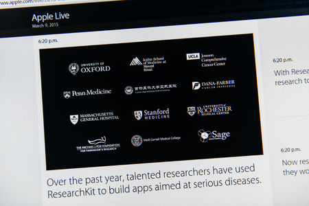 PARIS, FRANCE - MAR 9, 2015: Apple Computers event keynote tweets close up seen on iMac with talented researchers using REsearchKit to build apps for serious diseases as seen on 9 March, 2015のeditorial素材