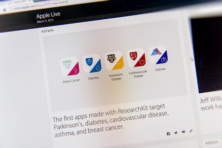PARIS, FRANCE - MAR 9, 2015: Apple Computers event keynote tweets close up seen on iMac with the first apps made with Apple ResearchKit target Parkinson's, diabetes, cardiovascular disease, asthma, and breast cancer  as seen on 9 March, 2015のeditorial素材