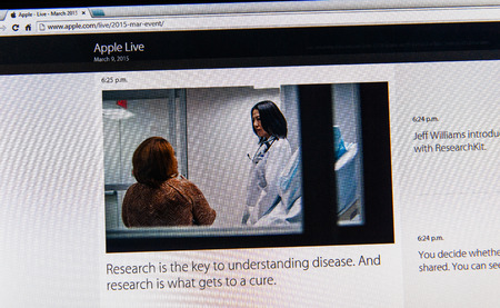 PARIS, FRANCE - MAR 9, 2015: Apple Computers event keynote tweets close up seen on iMac with the importance of research and cure as seen on 9 March, 2015のeditorial素材