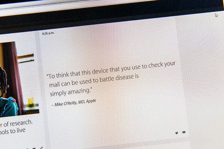 PARIS, FRANCE - MAR 9, 2015: Apple Computers event keynote tweets close up seen on iMac with the amazing potential for medical research of apple watch as seen on 9 March, 2015のeditorial素材