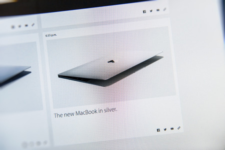 PARIS, FRANCE - MAR 9, 2015: Apple Computers event keynote tweets close up seen on iMac with the announcement of the new MacBook in Gold - the thinnest and lightest form ever with Retina display seen as the future of notebook as seen on 9 March, 2015のeditorial素材