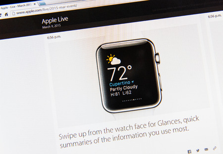 PARIS, FRANCE - MAR 9, 2015: Apple Computers event keynote tweets close up seen on iMac display with weather and other information user uses most as seen on 9 March, 2015のeditorial素材
