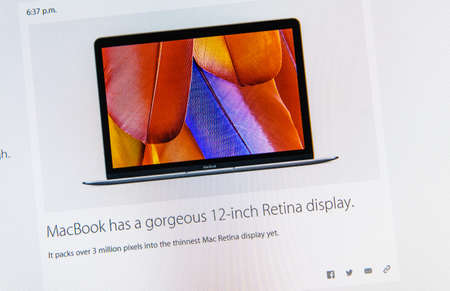 PARIS, FRANCE - MAR 9, 2015: Apple Computers event keynote tweets close up seen on iMac featuring MacBook gorgeus 12 inch Retina Display with the newly launched  as seen on 9 March, 2015のeditorial素材