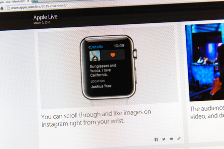 PARIS, FRANCE - MAR 9, 2015: Apple Computers event keynote tweets close up seen on iMac display with Instagram feed on Apple watch as seen on 9 March, 2015のeditorial素材