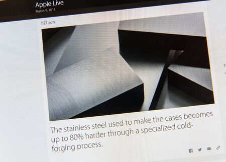 PARIS, FRANCE - MAR 9, 2015: Apple Computers event keynote tweets close up seen on iMac screen with stainless steel used to make Apple Watch cases as seen on 9 March, 2015のeditorial素材