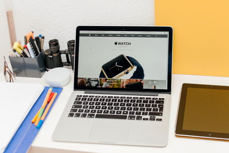 PARIS, FRANCE - MAR 10, 2015: Apple Computers website on MacBook Retina in room environment showcasing Apple Watch launch date as seen on 10 March, 2015のeditorial素材