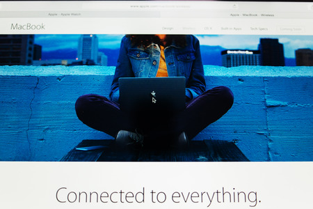 PARIS, FRANCE - MAR 10, 2015: Apple Computers website on MacBook Retina in room environment showcasing MacBook dedicated page stating Connected to evrything  as seen on 10 March, 2015のeditorial素材