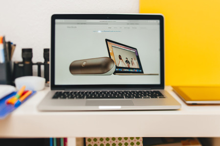 PARIS, FRANCE - MAR 10, 2015: Apple Computers website on MacBook Retina in room environment showcasing new MAcBook and Beats portable loudspeaker as seen on 10 March, 2015のeditorial素材