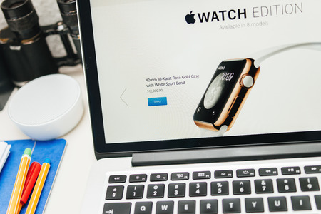 PARIS, FRANCE - MAR 10, 2015: Apple Computers website on MacBook Retina in room environment showcasing the price of 12000 USD for the golden Apple Watch Edition as seen on 10 March, 2015のeditorial素材