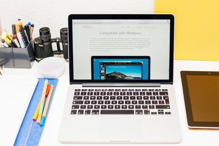 PARIS, FRANCE - MAR 10, 2015: Apple Computers website on MacBook Retina in room environment showcasing MacBook as compatible with Microsoft Windows as seen on 10 March, 2015のeditorial素材