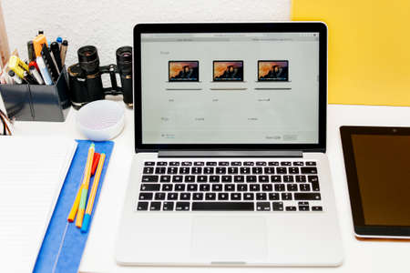 PARIS, FRANCE - MAR 10, 2015: Apple Computers website on MacBook Retina in room environment showcasing  as seen on 10 March, 2015のeditorial素材