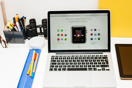 PARIS, FRANCE - MAR 10, 2015: Apple Computers website on MacBook Retina in room environment showcasing itunes music on Apple Watch as seen on 10 March, 2015のeditorial素材