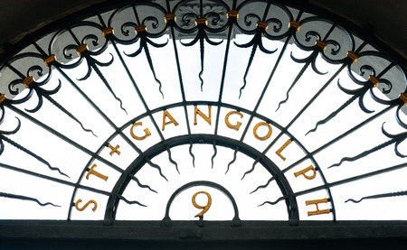 St. Gangloph sign above church's entrance. Saint Gangold is a Roman Catholic church in Trier, Germany. It is dedicated to St. Gangulphus. After Trier's Cathedral, it is the second oldest church building in the city.のeditorial素材