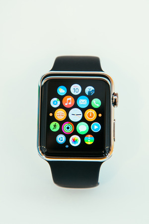 PARIS, FRANCE â APR 10, 2014: New wearable computer Apple Watch smartwatch displaying the new interface home screen. It incorporates fitness tracking and health-oriented capabilities and  integration with iOS Apple products and servicesのeditorial素材