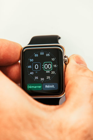 PARIS, FRANCE â€“ APR 10, 2015: New wearable computer Apple Watch smartwatch displaying the new...