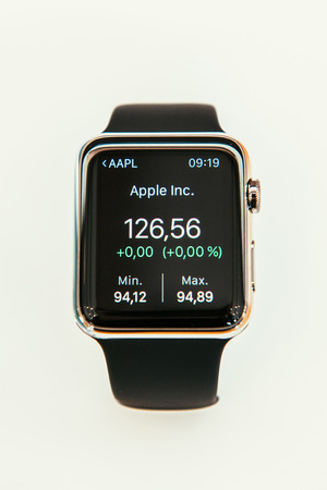 PARIS, FRANCE â APR 10, 2015: New wearable computer Apple Watch smartwatch displaying the new Stocks App with Apple Stock Price. Apple Watch incorporates fitness tracking and health-oriented capabilities and  integration with iOS Apple products and servのeditorial素材