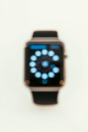 PARIS, FRANCE â€“ APR 10, 2015: New wearable computer Apple Watch smartwatch displaying the new...