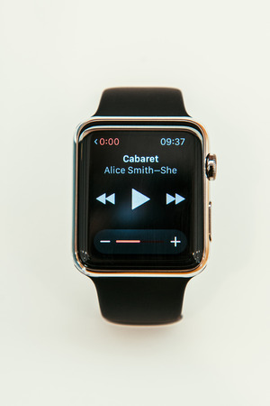 PARIS, FRANCE â APR 10, 2015: New wearable computer Apple Watch smartwatch displaying the new Music App. Apple Watch incorporates fitness tracking and health-oriented capabilities and  integration with iOS Apple products and servicesのeditorial素材