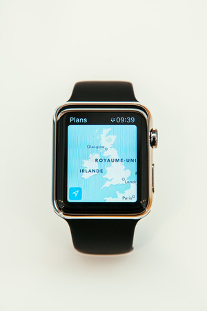 PARIS, FRANCE â APR 10, 2015: New wearable computer Apple Watch smartwatch displaying the new Maps App. Apple Watch incorporates fitness tracking and health-oriented capabilities and  integration with iOS Apple products and servicesのeditorial素材