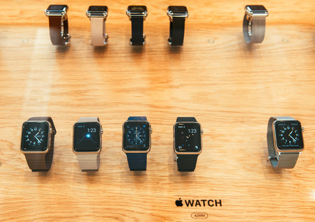 PARIS, FRANCE â APR 10, 2015: New wearable computer Apple Watch smartwatch displaying the Watch collection. Apple Watch incorporates fitness tracking and health-oriented capabilities and  integration with iOS Apple products and servicesのeditorial素材