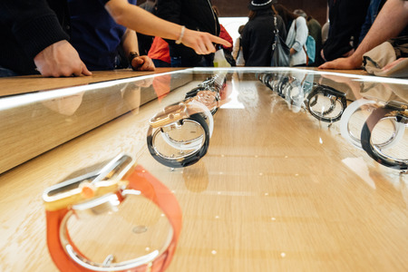 PARIS, FRANCE - APR 10, 2015: Apple genius presenting the Apple Watch smartwatchesfor customers and clients at Apple Store. The most wanted wearable device will be on sale from April 24 in 9 countries and regionsのeditorial素材