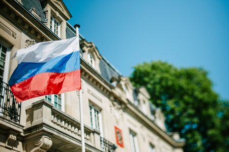 STRASBOURG, FRANCE - APRIL 18, 2015: Russian Federation flag waving in front of Consulate of Russia in Strasbourg, France. Tilt shift lens used to accent the flag for more natural effectのeditorial素材