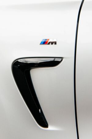 MUNCHEN, GERMANY - APRIL 06, 2015: BMW M sign on rear side of a sports car. BMW M GmbH (previously: BMW Motorsport GmbH) is a subsidiary of German car manufacturer BMW AG.のeditorial素材