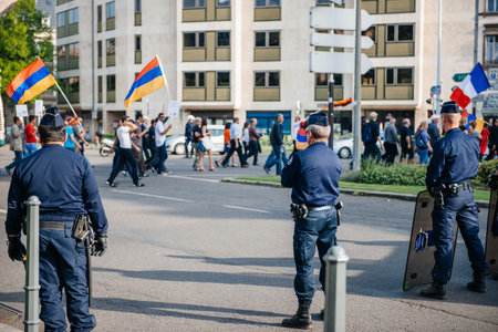 STRASBOURG, FRANCE - APRIL 24, 2015: Police surveillance over armenian protesters march for 100th...