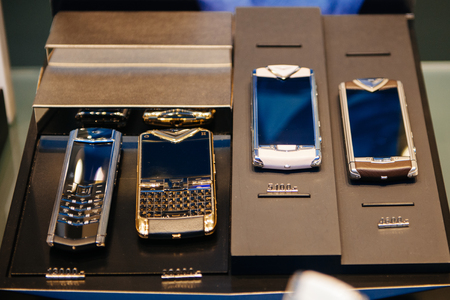 BADEN-BADEN, GERMANY - NOVEMBER 10, 2014: Vertu luxury mobile phones range  with price tag from 4600 to 30000 Euros, Baden-Baden. Vertu is a manufacturer and retailer of luxury, handmade mobile phonesのeditorial素材