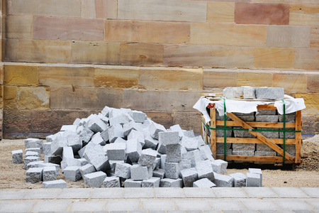 Pavement granite stones in atconstruction site during road repairの写真素材