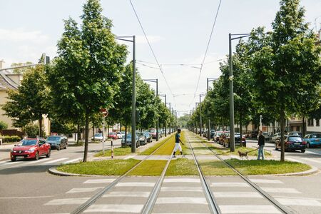 STRASBOURG FRANCE  MAY 23 2015: Black ethnicity man crossing roads in the middle of railroad trackのeditorial素材