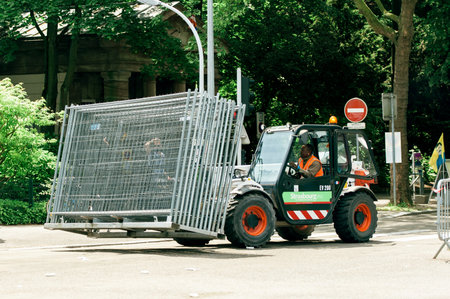 STRASBOURG FRANCE  MAY 17 2015: Tractor carrying metallic fence near Council of Europe just before a...