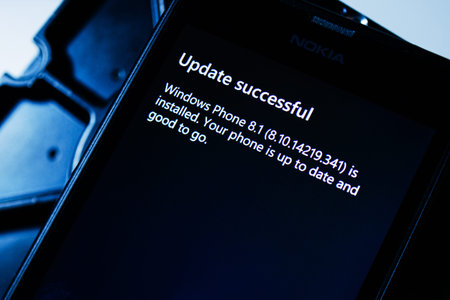 PARIS FRANCE  JANUARY 19 2015: Update Successful message on digital display of a Lumia Phone to...