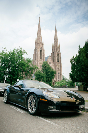 Chevrolet Corvette ZR 1 luxury sport car parked with St Paul church towers in backgroundl. Between 20082014 only 4684 were produced.のeditorial素材