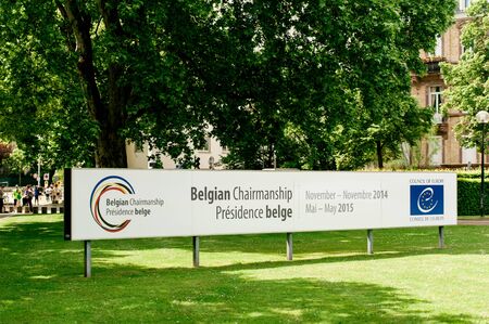 STRASBOURG FRANCE  MAY 17 2015: View of Belgian Chairmanship banner of the Council of Europe as seen in the green garden Council of Europe building in Strasbourg eastern Franceのeditorial素材