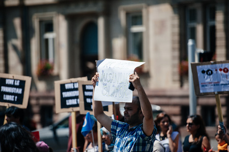 STRASBOURG, FRANCE - JULY 11, 2015: Uyghur human rights activists participate in a demonstration to protest against Chinese government's policy in Uyghurのeditorial素材