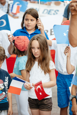 STRASBOURG, FRANCE - JULY 11, 2015: Uyghur human rights activists participate in a demonstration to protest against Chinese government's policy in Uyghurのeditorial素材