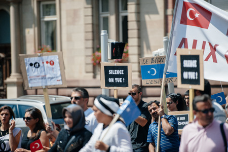 STRASBOURG, FRANCE - JULY 11, 2015: Uyghur human rights activists participate in a demonstration to protest against Chinese government's policy in Uyghurのeditorial素材