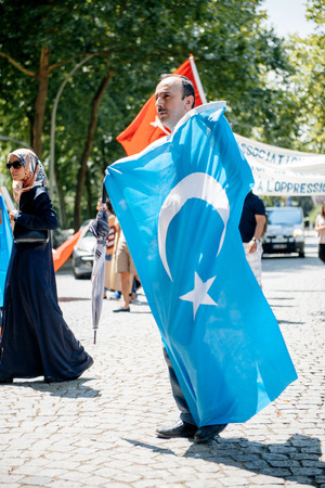 STRASBOURG, FRANCE - JULY 11, 2015: Uyghur human rights activists participate in a demonstration to protest against Chinese government's policy in Uyghurのeditorial素材